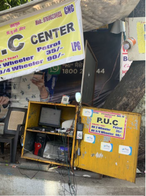 A computer, printer, and internet connection under a tree at a petrol station-an example of the famous Indian” jugaad” of improvisation and entrepreneurship
